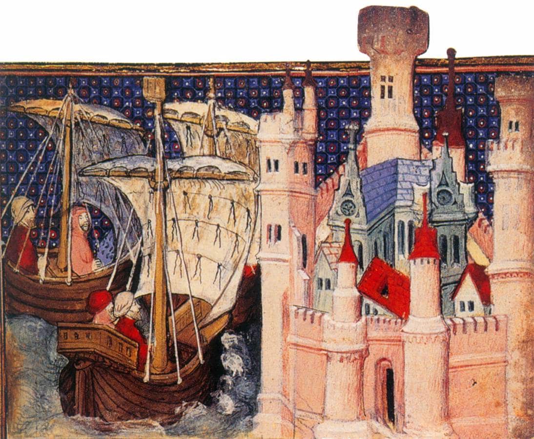 A medieval manuscript miniature of two sailing ships carrying hooded and capped men beside a pink-walled castle with red-roofed towers, against a patterned blue background.
