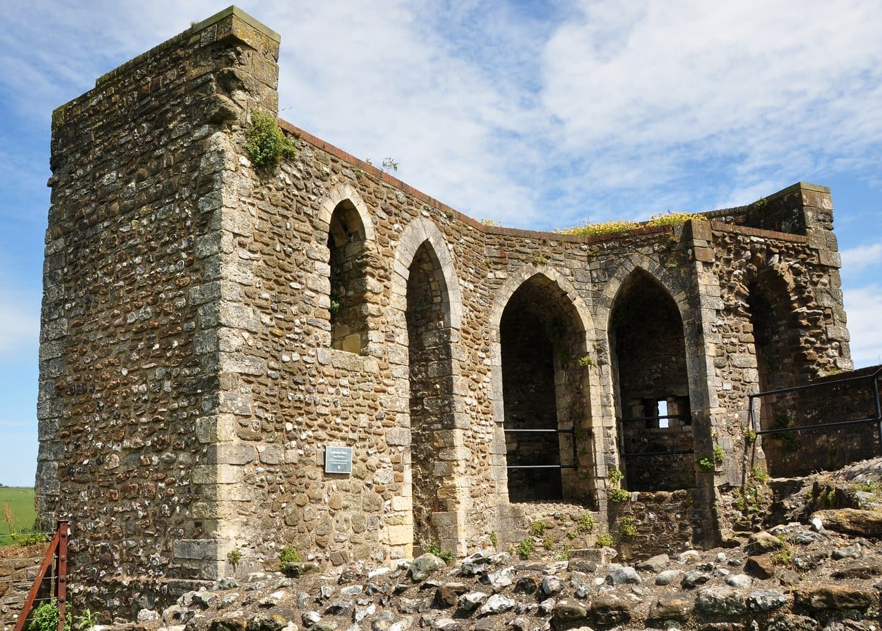 The open back of the multangular Avranches Tower, a row of tall pointed arches in rubble walling with dressed-stone quoins, a small loop showing daylight at the back of one arch. The open back of the multangular Avranches Tower, a row of tall pointed arches in rubble walling with dressed-stone quoins, a small loop showing daylight at the back of one arch.
