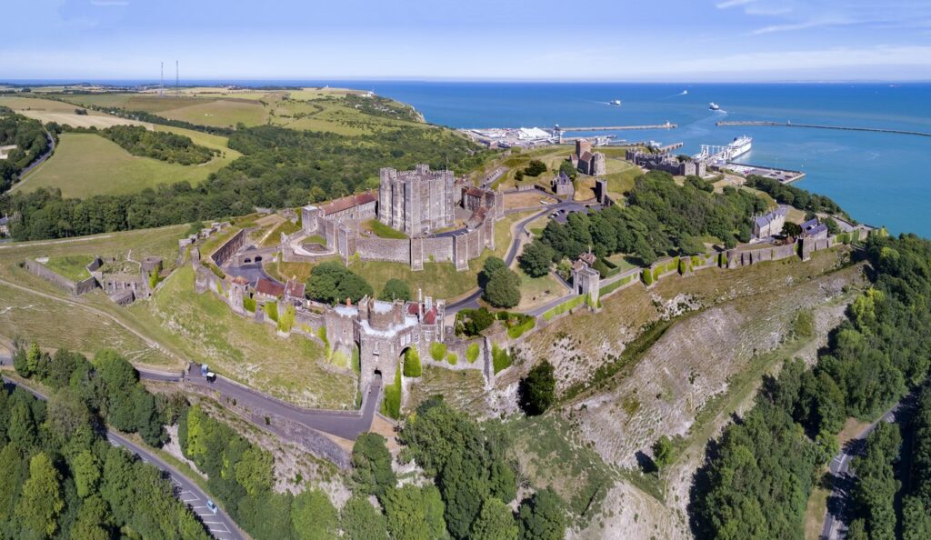Dover Castle 2 Aerial view of Dover Castle on its headland, the Great Tower inside its curtain walls, with the town and harbor beyond.