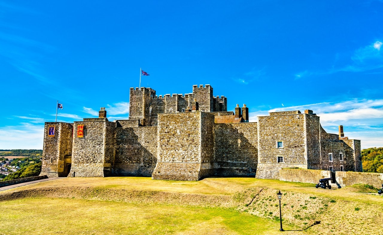 The Great Tower rising behind the inner bailey's curtain wall, with two heraldic banners hung on the wall and a flag flying from the tower. The Great Tower rising behind the inner bailey's curtain wall, with two heraldic banners hung on the wall and a flag flying from the tower.