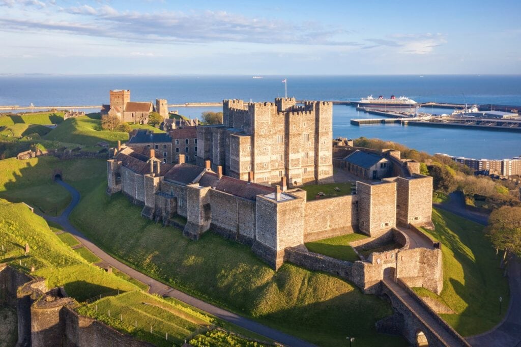Dover Castle 4 Low sunlight on the Great Tower and the walls of the inner bailey, with the harbor and a ferry beyond.