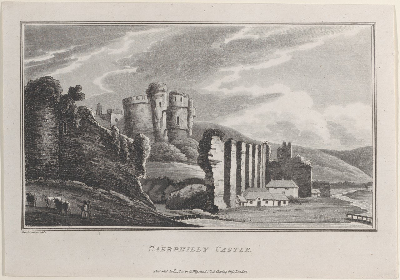 An eighteenth-century style aquatint of a ruined castle with round towers and a long buttressed wall, cottages at its foot and cattle with a herdsman in the foreground An eighteenth-century style aquatint of a ruined castle with round towers and a long buttressed wall, cottages at its foot and cattle with a herdsman in the foreground